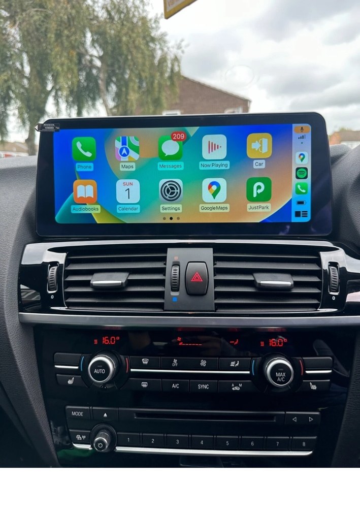 BMW X3 F25 / X4 F26 12.3-inch CarPlay screen installed in dashboard — customer-style installation photo